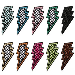May include: A set of ten embroidered lightning bolt patches arranged in two rows. Each patch features a checkered pattern in various colours including light blue, teal, pink, green, black, beige, orange, magenta, lime, and brown with black borders.
