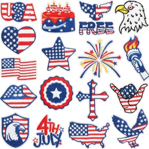 May include: A set of 16 iron-on patches featuring patriotic American symbols, including the American flag, stars, stripes, an eagle, fireworks, a cross, a cake, and the words "USA" and "FREE".