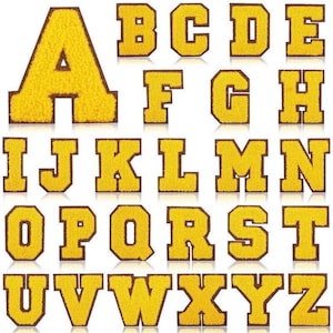 May include: A complete alphabet of yellow chenille letters with brown edging. Each letter is shown separately, presenting the full set from A to Z. Suitable for crafting or customisation.