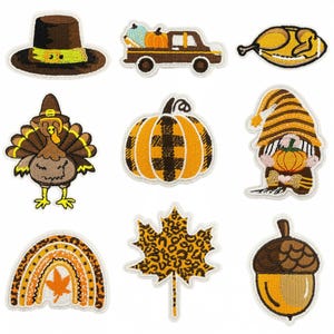 May include: A selection of embroidered patches with autumnal designs. Includes a pilgrim hat, a truck carrying pumpkins, a roasted turkey, a turkey, a plaid pumpkin, a gnome holding a pumpkin, a rainbow, a leopard print leaf, and an acorn.
