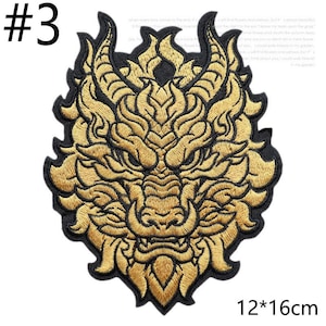May include: Embroidered patch featuring a golden dragon head with intricate details, outlined in black. The patch measures 12 by 16 cm. The number "3" is in the upper left corner.