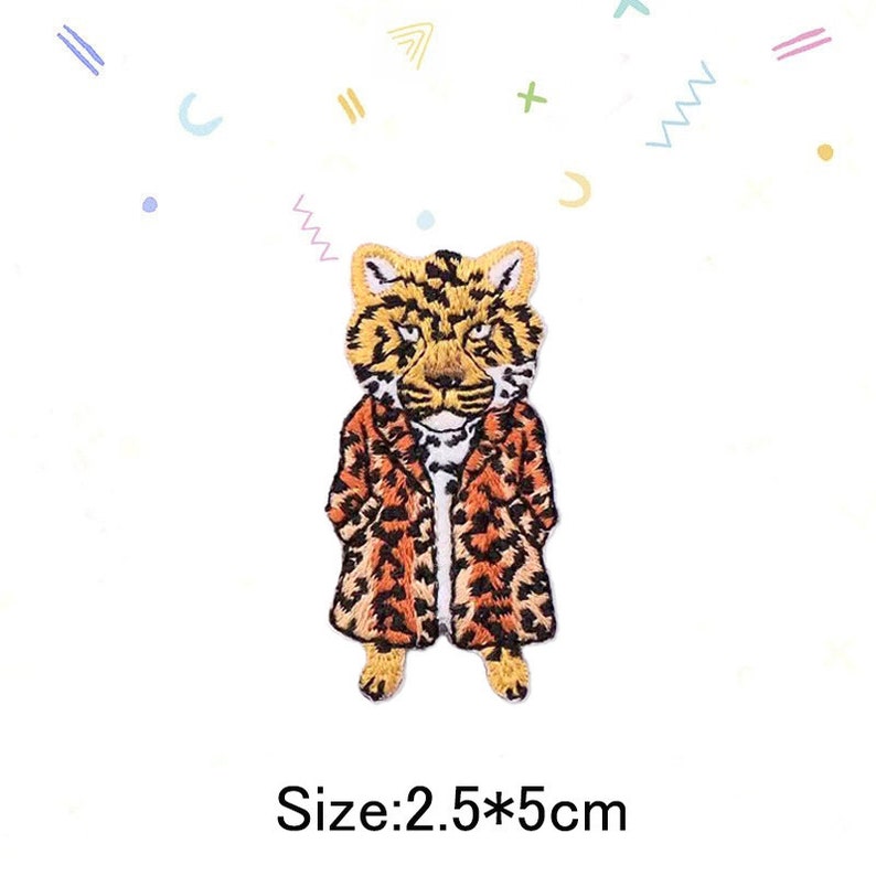 May include: An embroidered iron-on patch of a leopard wearing a leopard print coat. The patch is 2.5 inches by 5 inches.