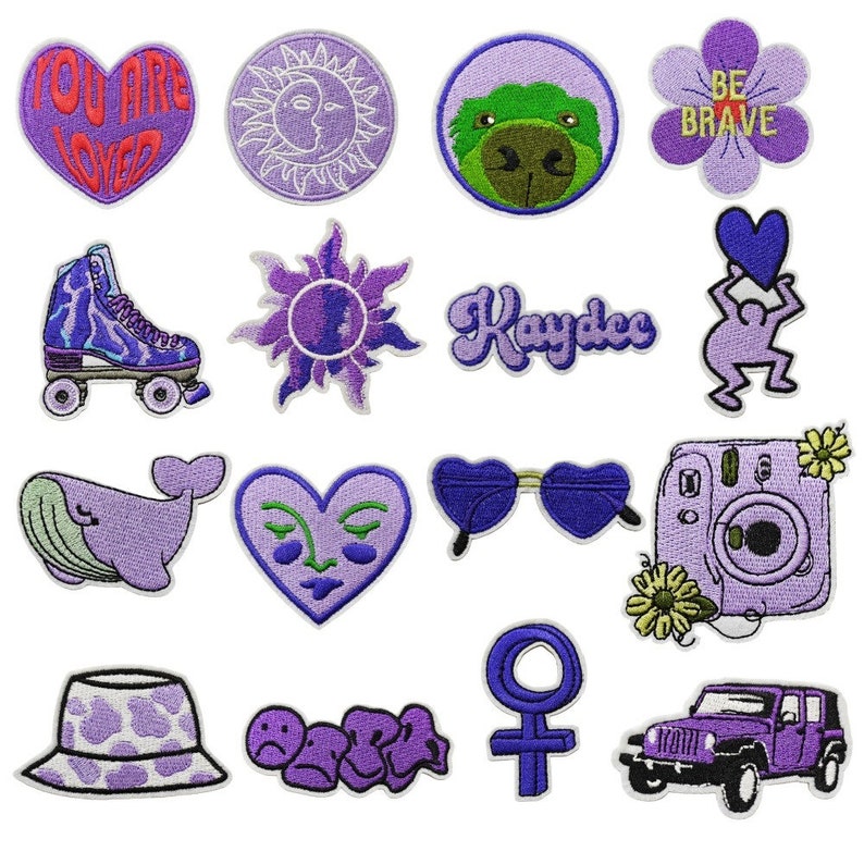 May include: A set of 16 purple embroidered iron-on patches featuring various designs, including a heart with the text "You Are Loved", a sun and moon, a whale, a pair of sunglasses, a camera, a roller skate, a flower with the text "Be Brave", a female symbol, a jeep, a sun, a heart with a face, a cartoon figure, a hat, a name, and a group of sad faces.