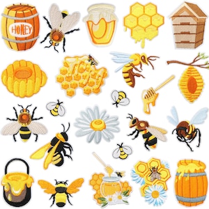 May include: A collection of embroidered patches featuring honey-related designs. Includes a barrel with "HONEY" text, bees, honeycombs, honey jars, a beehive, and a daisy. The patches are in shades of yellow, brown, and white.