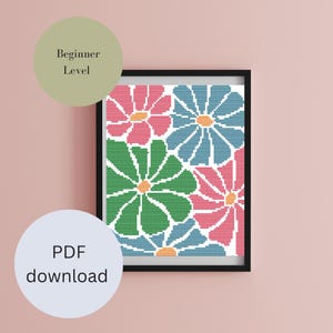 Könnte beinhalten: Ein Kreuzstichmuster mit einem farbenfrohen Blumendesign mit rosa, blauen und grünen Blumen. Das Muster ist als Anfängerlevel gekennzeichnet und als PDF-Download verfügbar.