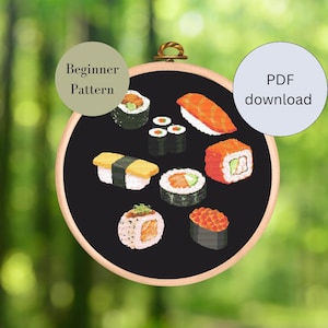 Könnte beinhalten: Ein schwarzer Stickrahmen mit verschiedenen Sushi-Designs, darunter Nigiri, Maki und Sashimi. Der Text "Beginner Pattern" und "PDF download" ist auf dem Bild zu sehen.