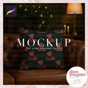 May include: A decorative pillow with a dark teal background featuring a pattern of teddy bears wearing red and blue sweaters. The word "MOCKUP" is displayed in large white letters, with the text "See your art come to life!" below.