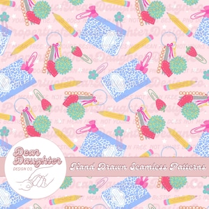 May include: A seamless pattern on a light pink background featuring repeating illustrations of blue leopard print notebooks, yellow pencils, pink heart-shaped keychains, teal pom-poms, and strawberry-shaped paper clips with small flowers.