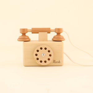 Telefono giocattolo antico in latta rosso e oro. Salvadanaio vintage  recuperato. Telefono souvenir per bambini da collezione. -  Italia