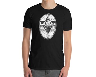 May include: Black t-shirt featuring a white graphic design. The design includes geometric shapes, a central figure, and text around the oval shape. The shirt is made of a soft material.