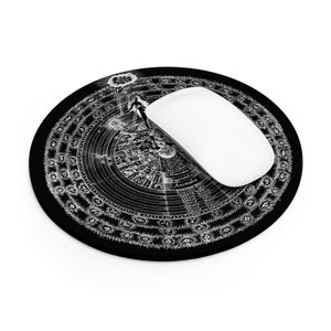 May include: A black round mouse pad with a white circular design featuring a diagram of the Great Chain of Being. The design includes text in Latin and English, including "Animalia", "Vegetabilia", "Mineralia", and "Homo Ludens".