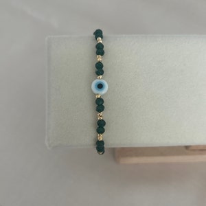 Pearl bracelet with green crystal beads and Nazar Boncuk/ Evileye charm