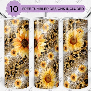 May include: Three stainless steel tumblers with a white background and a design of gold glitter, leopard print, and sunflowers. The text "10 FREE TUMBLER DESIGNS INCLUDED" is at the top of the image.