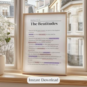 May include: A framed print of The Beatitudes from Matthew 5:3-12, displayed on a windowsill. The text is in black, with some phrases highlighted in purple. The words "Instant Download" are at the bottom of the frame.