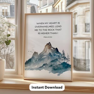 May include: A printable wall art print with a watercolor painting of mountains and the text "WHEN MY HEART IS OVERWHELMED, LEAD ME TO THE ROCK THAT IS HIGHER THAN I PSALM 612".