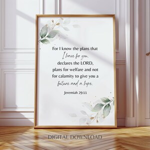 May include: A framed print with the text "For I know the plans that I have for you...Jeremiah 29:11." The print has a white background with botanical accents and a gold frame. The words "DIGITAL DOWNLOAD" are at the bottom.