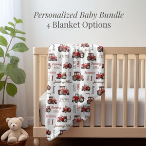 May include: A white baby blanket with a red tractor pattern. The blanket features the name "Jeremy Ellis" repeated throughout the design.