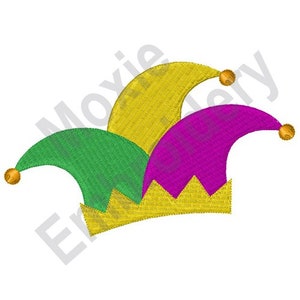 May include: A jester's hat with three points, one green, one yellow, and one purple. Each point has a gold ball on the end. The hat has a gold trim around the bottom.