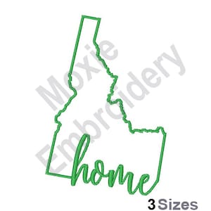 May include: Green outline of the state of Idaho with the word "home" written in cursive inside the state outline.