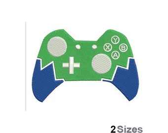 Peut inclure: Manette de jeu vidéo verte et bleue avec des boutons étiquetés A, B, X et Y. La manette est dans un design cassé ou fissuré.