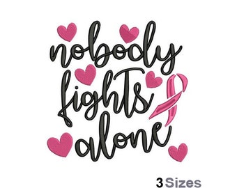 May include: Black and white embroidery design with the text "nobody fights alone" and a pink ribbon. The design is surrounded by pink hearts.