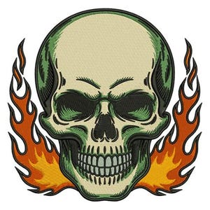 May include: Embroidered skull design with green and black details, surrounded by orange and yellow flames. The skull has a neutral beige color and a detailed, stitched appearance. The design is on a white background.