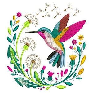 May include: Embroidered design of a hummingbird in flight, surrounded by dandelions and floral elements. The bird features vibrant colours including pink, teal, yellow, and brown. The design is set against a white background.