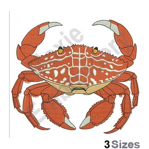 May include: An embroidered crab design in shades of orange, white, and yellow. The crab has detailed stitching, with a textured shell and prominent claws. The image includes the text "3 Sizes" at the bottom, indicating available size options for the design.