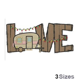 May include: Embroidered design of the word "HOME" with a camper trailer in the middle of the word. The camper is brown and tan with a pink stripe and has Christmas lights strung around it.