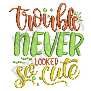 May include: Orange, green, and yellow embroidered text that reads "Trouble never looked so cute."