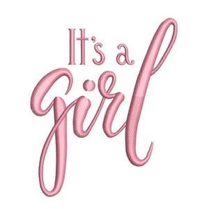 May include: Pink embroidered text on a white background reads "It's a girl." The script is in a cursive font, with the word "girl" in a larger, more stylized font. The design is likely for a baby shower or birth announcement.