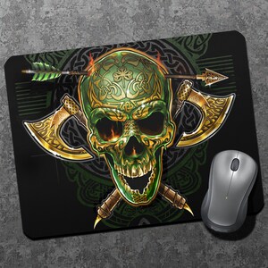May include: A green skull with gold Celtic knotwork design, crossed axes, and an arrow through the skull. The skull is on a black background with a green Celtic knotwork pattern.