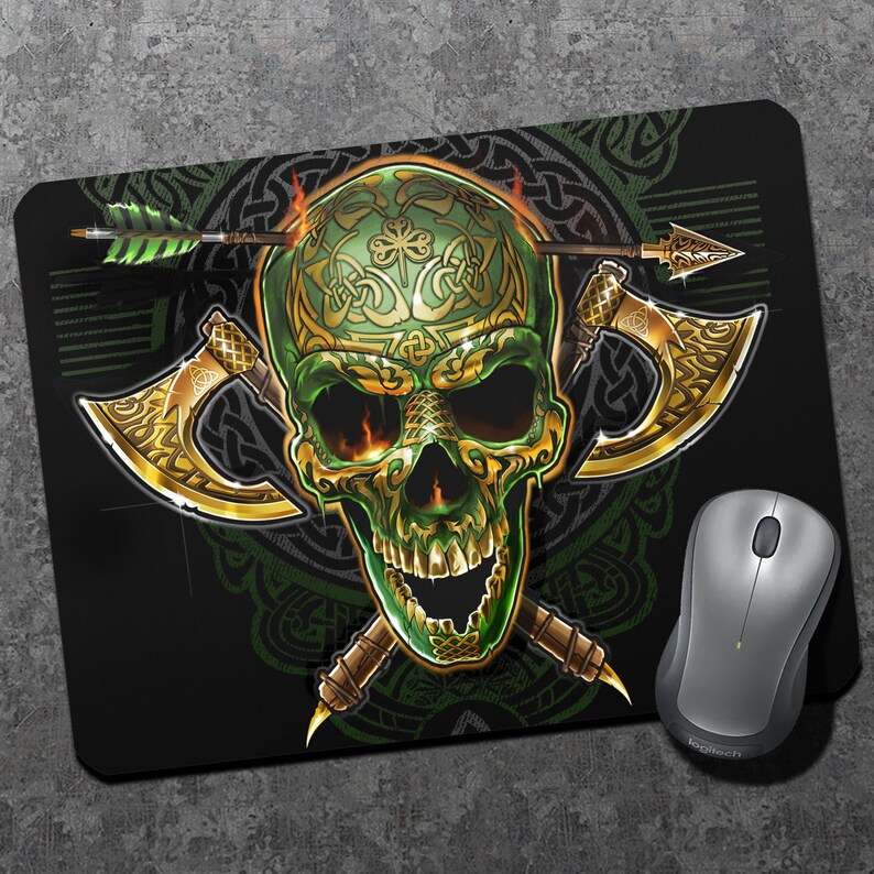 May include: A green skull with gold Celtic knotwork design, crossed axes, and an arrow through the skull. The skull is on a black background with a green Celtic knotwork pattern.