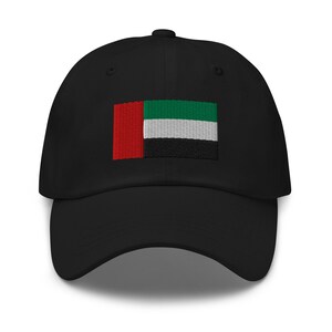 May include: A black baseball cap with an embroidered flag of the United Arab Emirates. The flag is red, white, green, and black.