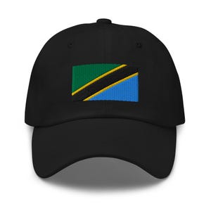 May include: A black baseball cap with an embroidered flag of Tanzania. The flag is green, yellow, black, and blue.