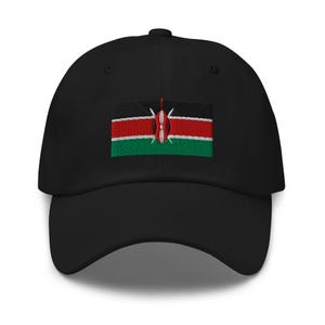 May include: A black baseball cap with an embroidered Kenyan flag on the front. The flag is red, black, green, and white with a shield in the centre.