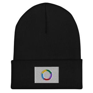 May include: Black beanie with a white patch featuring a colourful circle design.