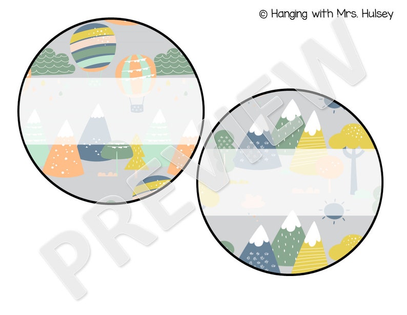 May include: Two round printable labels with a mountain and hot air balloon theme. The labels feature a gray background with colorful mountains, trees, and clouds. The top label has a hot air balloon with stripes and a basket. The bottom label has a sun and a tree. Both labels have a blank space for text.