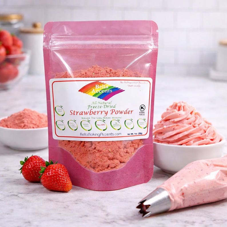 Strawberry powder used to color pink buttercream frosting with piping bag and fresh strawberries