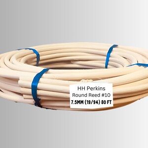 May include: Coiled round reed, secured with blue bands. The label reads "HH Perkins Round Reed #10 7.5MM (19/94) 80 FT". This natural-toned reed is likely used for weaving or basketry projects.