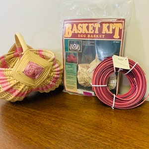 May include: A wicker egg basket kit with pink and natural colored reeds. The kit includes a booklet with instructions and a roll of red reed.