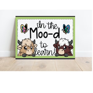 May include: A green and white sign with the text "In the Moo-d to learn!"  Two cartoon cows peek out from the sides of the sign.  Butterflies are on either side of the text.