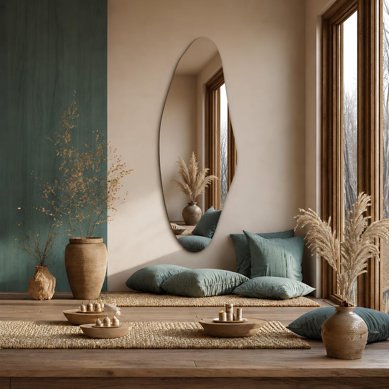 Large frameless geometric organic wall mirror featuring a tall sculptural silhouette with softly faceted contours and polished edges. Crafted from premium-quality mirror glass, it delivers a bright, natural reflection while adding artistic depth and visual interest to any space. Ideal for entryways, living rooms, bedrooms, dressing areas, and hallways. Its distinctive contemporary design complements modern, minimalist, Scandinavian, Japandi, and luxury interiors.