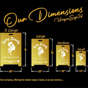 May include: Gold-colored sign with the text "Lucky Beauty Wellness & Spa" in various sizes: X Large (44" x 28"), Large (36" x 23"), Medium (28" x 18"), and Small (20" x 13"). Each sign has a handle and an arrow indicating "Open".