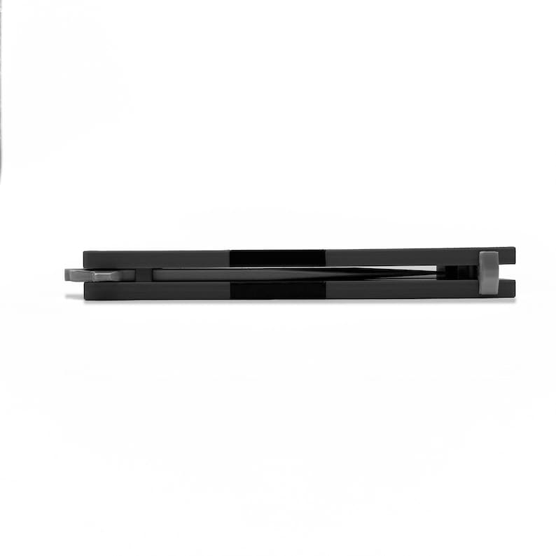 Horizontal side profile of closed TF2 Spy Butterfly Knife replica with black balisong handle and silver blade tip visible, Team Fortress 2 cosplay prop