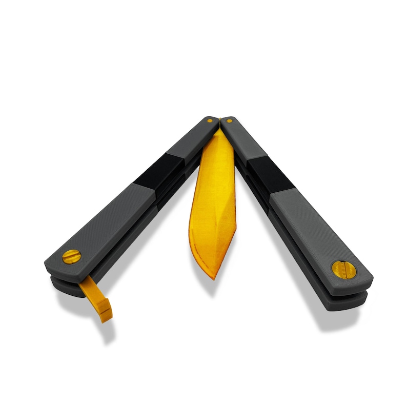 TF2 Spy Butterfly Knife replica caught mid-flip with handles spread apart revealing gold blade between black balisong scales, Team Fortress 2 cosplay prop