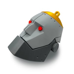 May include: A gray, stylized robot head with a gold crown and red eyes. The robot head has a rectangular jaw and a loop on top. The head is made of metal and has visible screws.