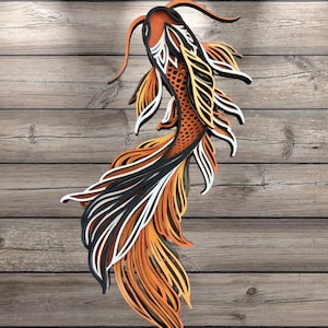 May include: A layered wooden koi fish wall art piece. The fish features orange, black, white, and yellow details. The artwork is mounted on a wooden plank background, creating a three-dimensional effect. The fish's fins and tail are intricately designed.