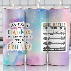 May include: Three stainless steel tumblers with a colorful galaxy design. One tumbler has the text "WORK MADE US COWORKERS BUT THE FUN AND LAUGHTER MADE US FRIENDS". Another has a "WORK BESTIE" label with nutritional facts.