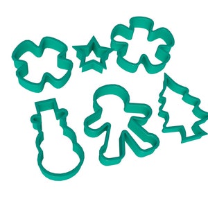 May include: A collection of seven teal-colored cookie cutters in various holiday shapes. The shapes include a snowman, gingerbread person, Christmas tree, star, and a snowflake-like design. These cutters are ideal for making festive cookies.
